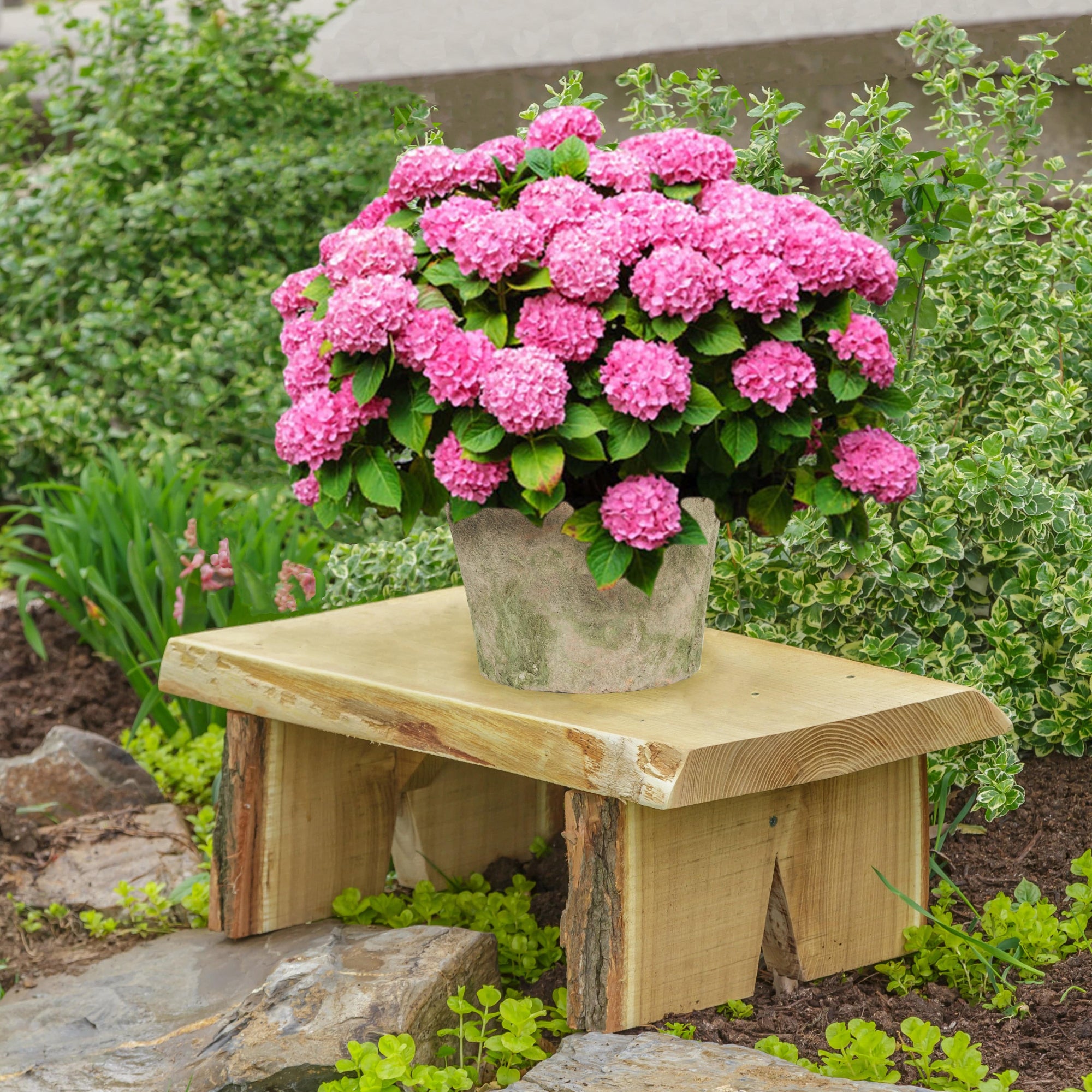 Live edge outdoor flower pot bench with pink flowers